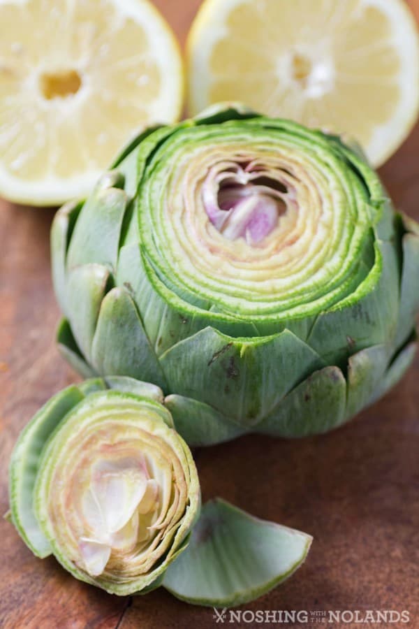 how to cook artichokes: soak them in water with lemon